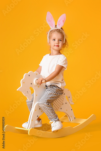Cute little girl in bunny e...