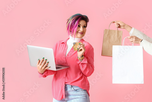 Beautiful women with credit...