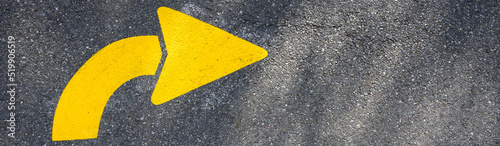 Freshly painted yellow arrows on asphalt for driving directions  © knelson20