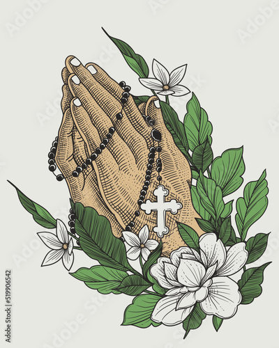 praying hands with a rosary necklace and floral ornament
