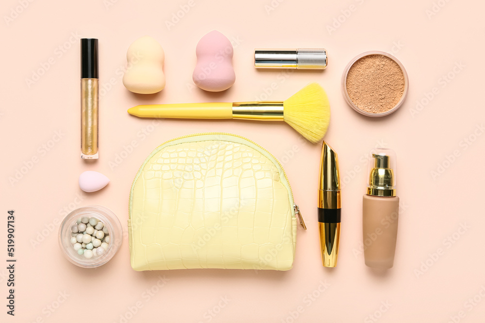 Composition with bag, cosmetics and makeup accessories on pink background Composition with bag, cosmetics and makeup accessories on pink background