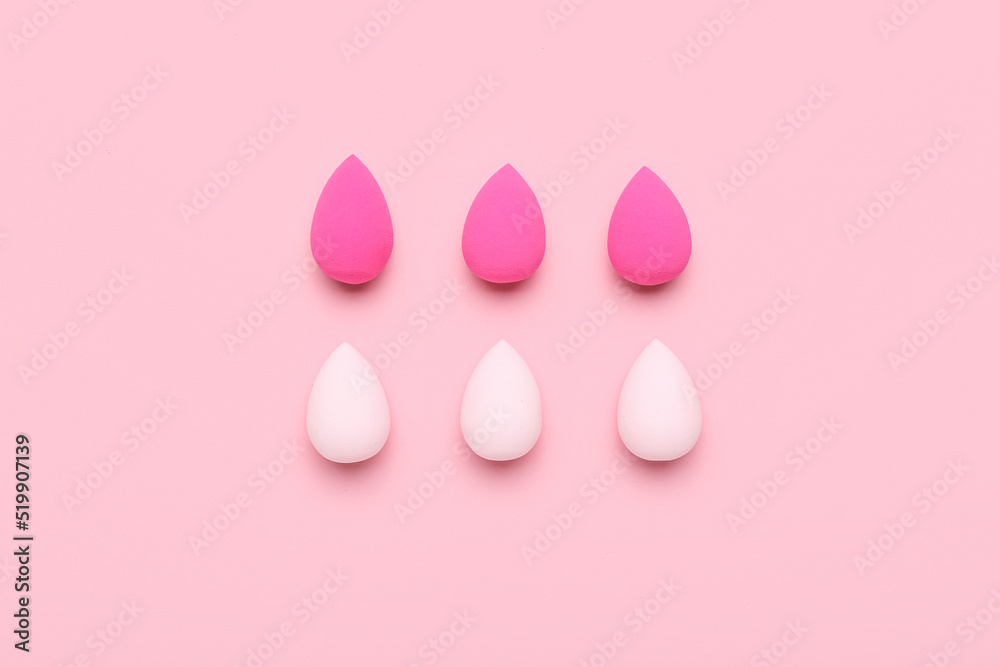 Set different of makeup sponges on pink background