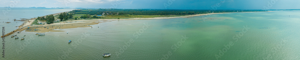Aerial drone view of coastal scenery in Tanjung Kempit, Mersing, Johor, Malaysia. Aerial drone view of coastal scenery in Tanjung Kempit, Mersing, Johor, Malaysia.