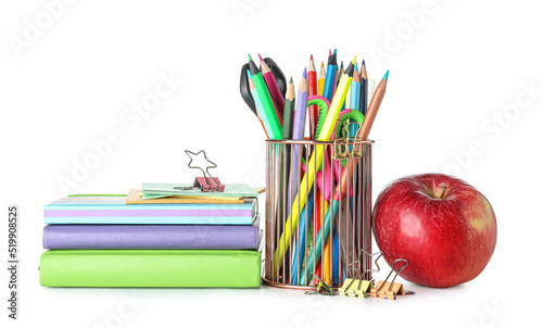 Cup with school stationery, apple and books on white background