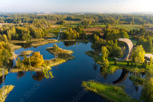 Amazing aerial view of Kirkilai karst lakes and lookout tower in the bright sunny autumn morning, Birzai, Lithuania