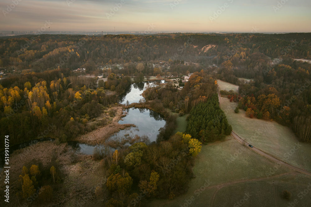 Aerial early morning view of trees and river. Fall city park scenery in Vilnius, Lithuania