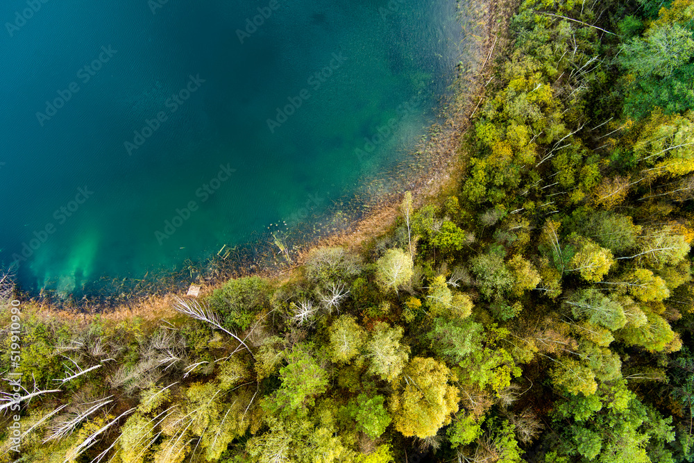 Aerial top down view of beautiful green waters of lake Gela. Clouds reflecting in Gela lake, near Vilnius city, Lithuania