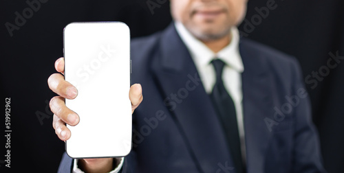 businessman asian standing wearing suit hand holding smartphone and showing blank white screen  professional man person happy using technology application for online business banking indoor of office
