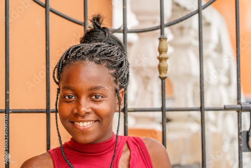 Happy teen girl. Smiling and looking at the camera.