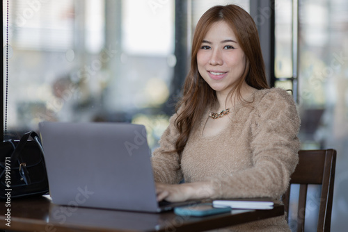 Freelancer Business asian woman or study online asian girl student having coffee and doing har work in cafe.