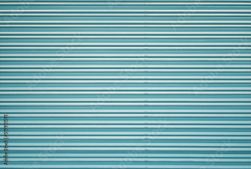 Corrugated metal roller shutter texture. Turquoise steel door for background.