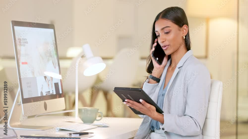 Marketing agent reading a strategy plan from her tablet while on a phone call with her business colleagues. Lady working as a sales analyst is talking about a creative advertising project to a client Marketing agent reading a strategy plan from her tablet while on a phone call with her business colleagues. Lady working as a sales analyst is talking about a creative advertising project to a client
