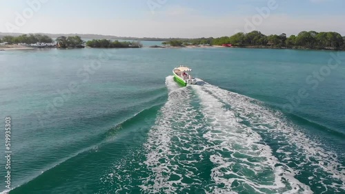 Aerial view flying over a boat in a tropical region of Cartagena, Colombia