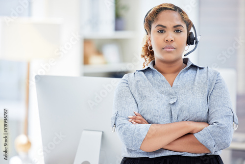 Quadro em tela Serious female customer service worker with headphones at the office at a call center