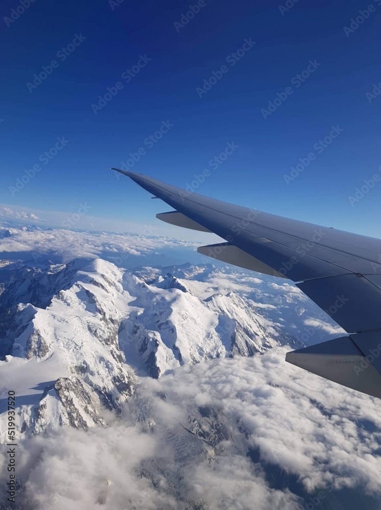 view from airplane window of mountains view from airplane window of mountains
