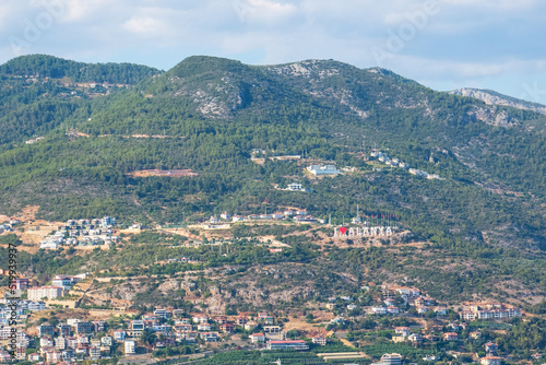 The inscription "I love Alanya" and houses on a hill in Alanya, Turkey
