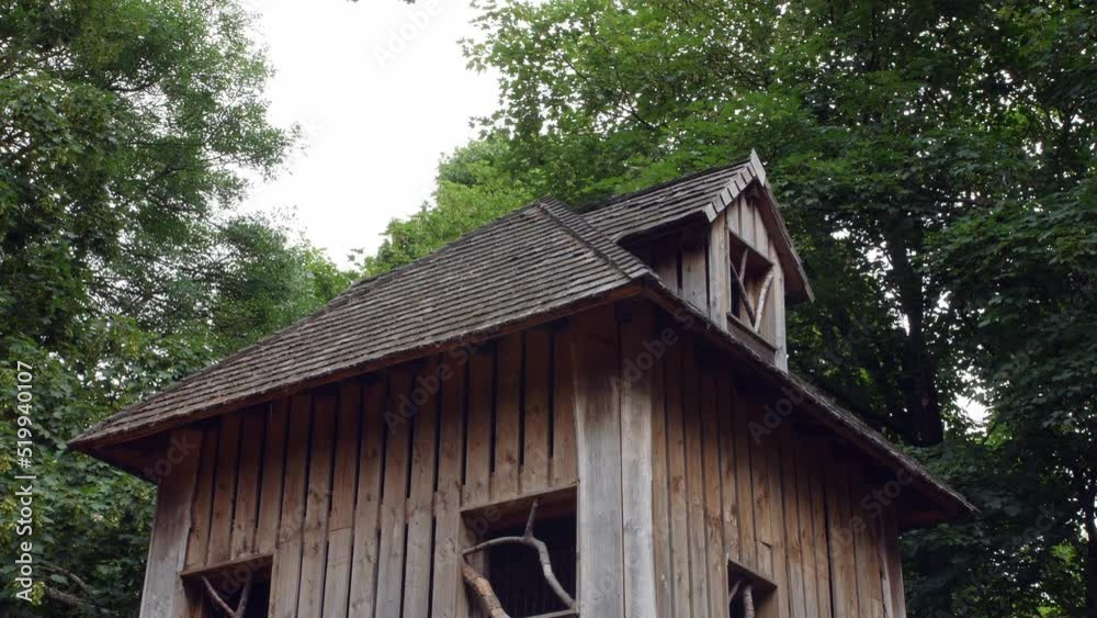 A large tree house with the wind blowing in the trees A large tree house with the wind blowing in the trees
