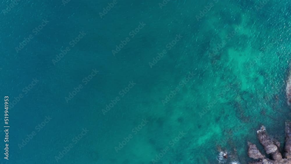 Aerial view of Koh Larn beach, Pattaya with blue turquoise seawater on the famous island of Koh Larn, Pattaya, Thailand, tourism outdoor. Andaman sea in island in summer, travel trip. Drone b roll.