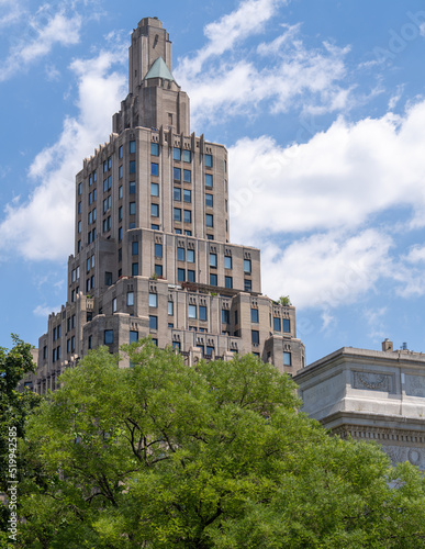 A building rises out of downtown Manhattan outside of Washington Square Park