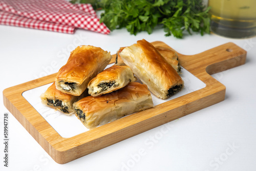 Handmade Spinach Cheese Pie - pastry, Turkish name; el acmasi borek, rulo borek. Turkish borek rolls with spinach and cheese. A traditional Turkish pastry rulo borek photo