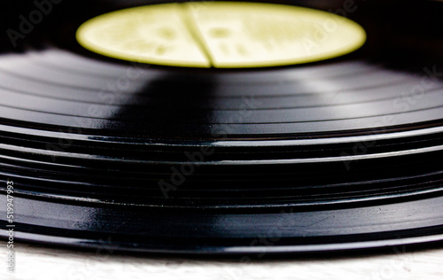 Stack of original vinyl records close-up. Music vinyl records LP with blur.