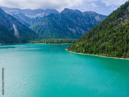 View from Top to the Austrian Plansee lake and its turquoise water and the deep green woods as a pure nature vacation spot © Wolfgang Hauke