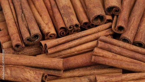 Cinnamon. Cinnamon stick close up, rotation. Heap of cinnamon stick photo