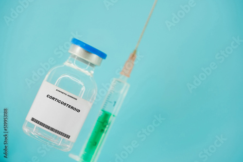 Corticosteroid. Test tube with artificial hormone on pink background Corticosteroid photo