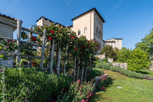 The medieval castle Rocca di Angera on the shores of the Lake Maggiore and its beautiful garden, Lombardy, Italy