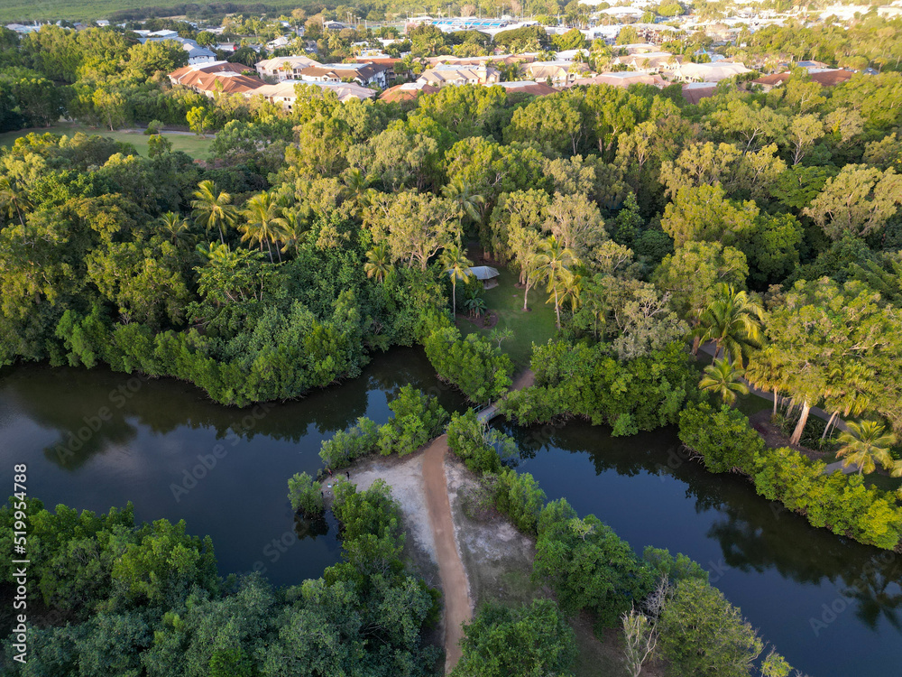 Aerial shot of path and bridge on river at sunset in Cairns