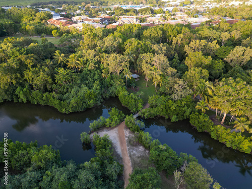 Aerial shot of path and bridge on river at sunset in Cairns