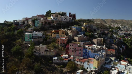 Aerial drone forward moving shot over residential buildings and houses over hills of Tijuana, Mexico, filmed during morning time. photo