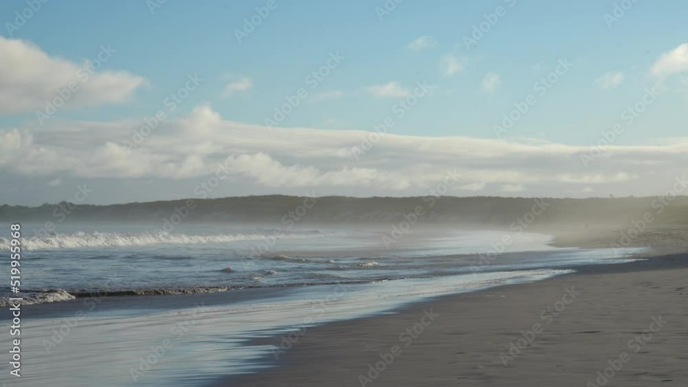 Ocean Spray Off Waves Breaking On Tortuga Bay Beach On Santa Cruz Island In The Galapagos. Slow Motion Ocean Spray Off Waves Breaking On Tortuga Bay Beach On Santa Cruz Island In The Galapagos. Slow Motion