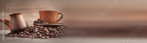  Clay coffee cup and pot on coffee beans.