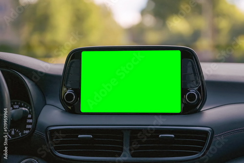 Obraz na płótnie Close up display with green screen on car panel, car driving with navigation concept, blank screen dashboard. w salonie