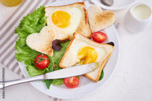 Fried Egg on Toast Bread and cup of fresh hot coffee on light grey background