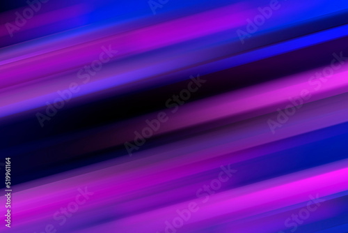 Multi colored neon lights on dark city street.