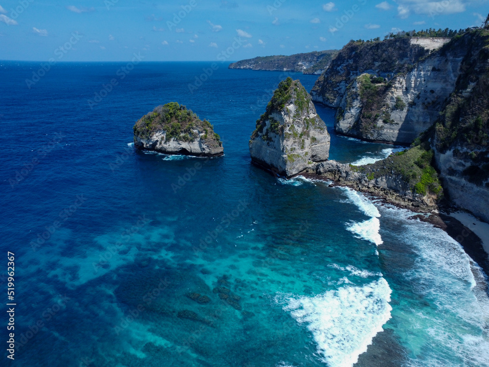 Aerial photo of Nusa Penida bay, white waves and crystal clear water