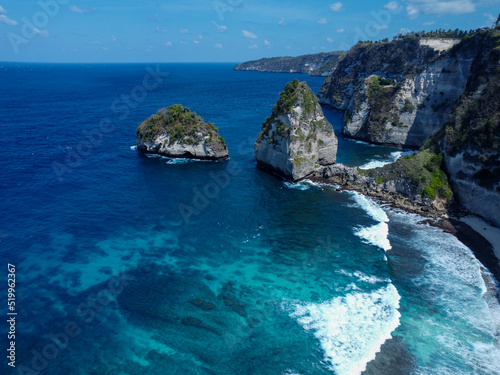 Aerial photo of Nusa Penida bay, white waves and crystal clear water