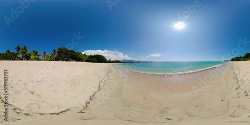Sandy beach with palm trees and ocean surf with waves. Saud Beach, Pagudpud. Philippines. 360 panorama VR. photo