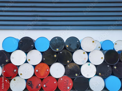 Several gallon old fuel tanks stacked on top of each other. Pattern