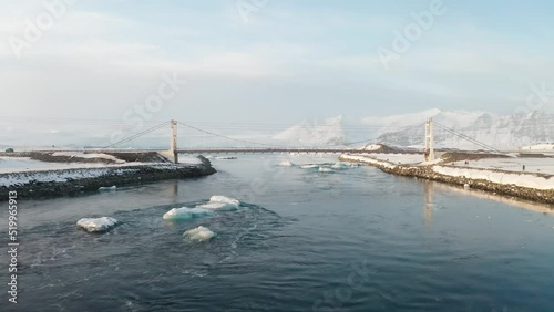 Wallpaper Mural Moving under a bridge with a drone in the middle of the winter and over the sea in Iceland. Torontodigital.ca