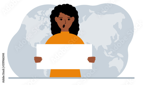 The concept of world attention. A woman holds a white poster in his hands against the background of a world map.