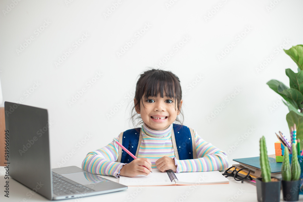 Asian girl studying at school looking very happy Asian girl studying at school looking very happy