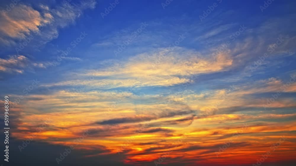 Beautiful sky clouds nature landscape at sunset. Colorful clouds move on the blue sky. 