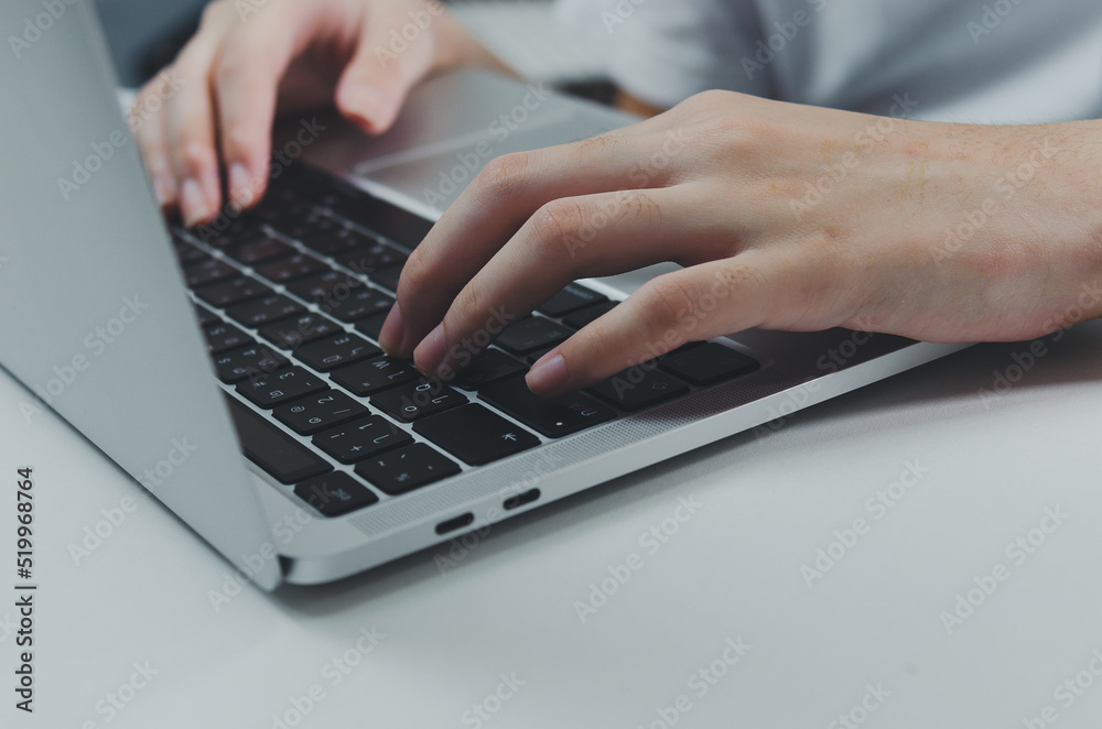 close up hand woman typing keyboard computer laptop on desk.Business technology online and communication on desk. close up hand woman typing keyboard computer laptop on desk.Business technology online and communication on desk.