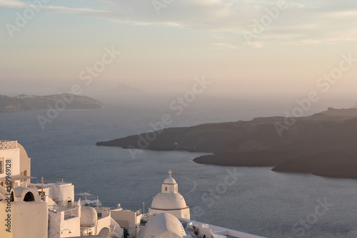 Wonderful view of the famous village of Fira in Santorini, the blue Aegean Sea and the volcano
