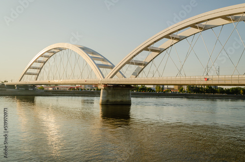 Novi Sad  Serbia. July - 25. 2022. Zezelj bridge on river Danube in Novi Sad. View of the Zezelje Bridge on the Danube in Novi Sad from the Petrovaradin side in the summer and in the afternoon.