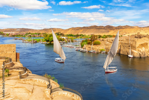 The Nile river scenery and traditional sailboats, Aswan, Egypt