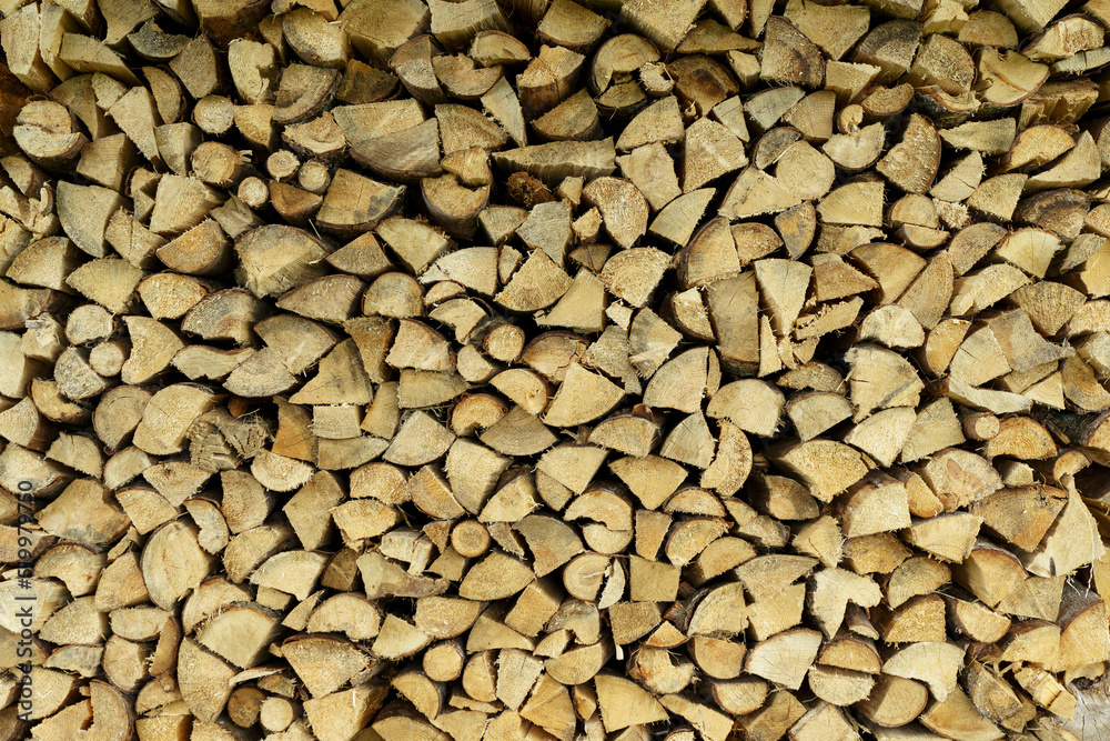 Firewood background. Sawn trunks and logs of needles and birch for making a fire and decor. Firewood background. Sawn trunks and logs of needles and birch for making a fire and decor.